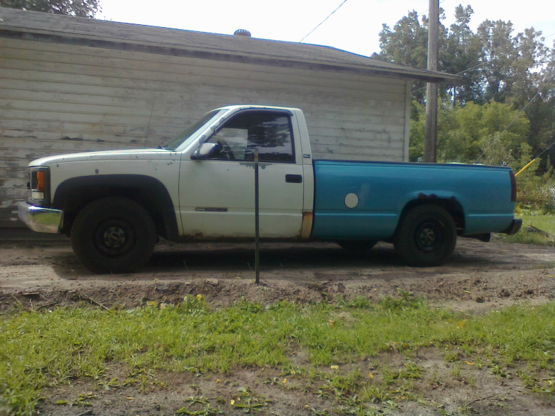 21 bags of concrete (1680 lbs) onboard, sags the bed rail down to about 48 inches